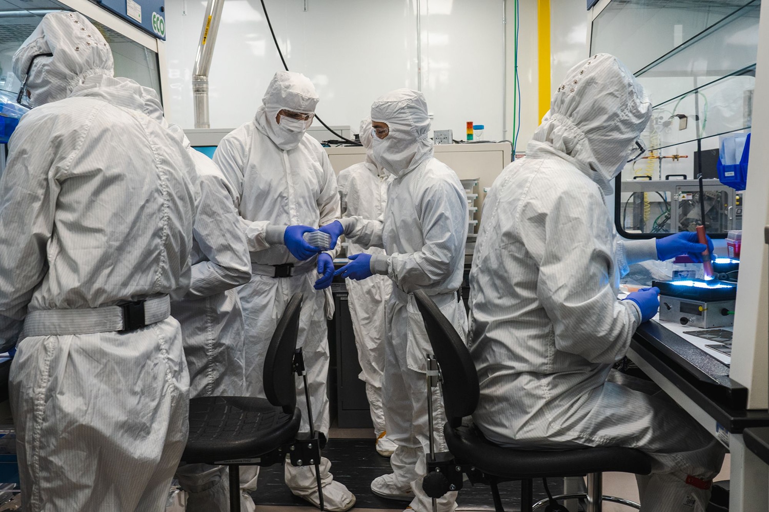Photograph of lab techs in Personal Protective Equipment